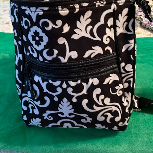 Brand new Thirty- one purse. Black and white swirl design. Several zippers. - Picture 1 of 6